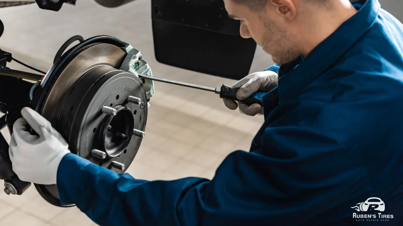 Technician inspecting a brake system to ensure optimal performance.