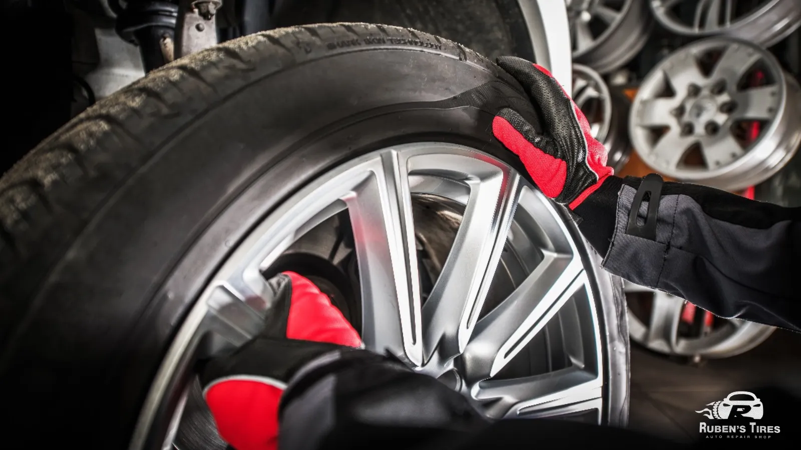 Technician inspecting and rotating tires at Ruben’s Tires in Altamonte.