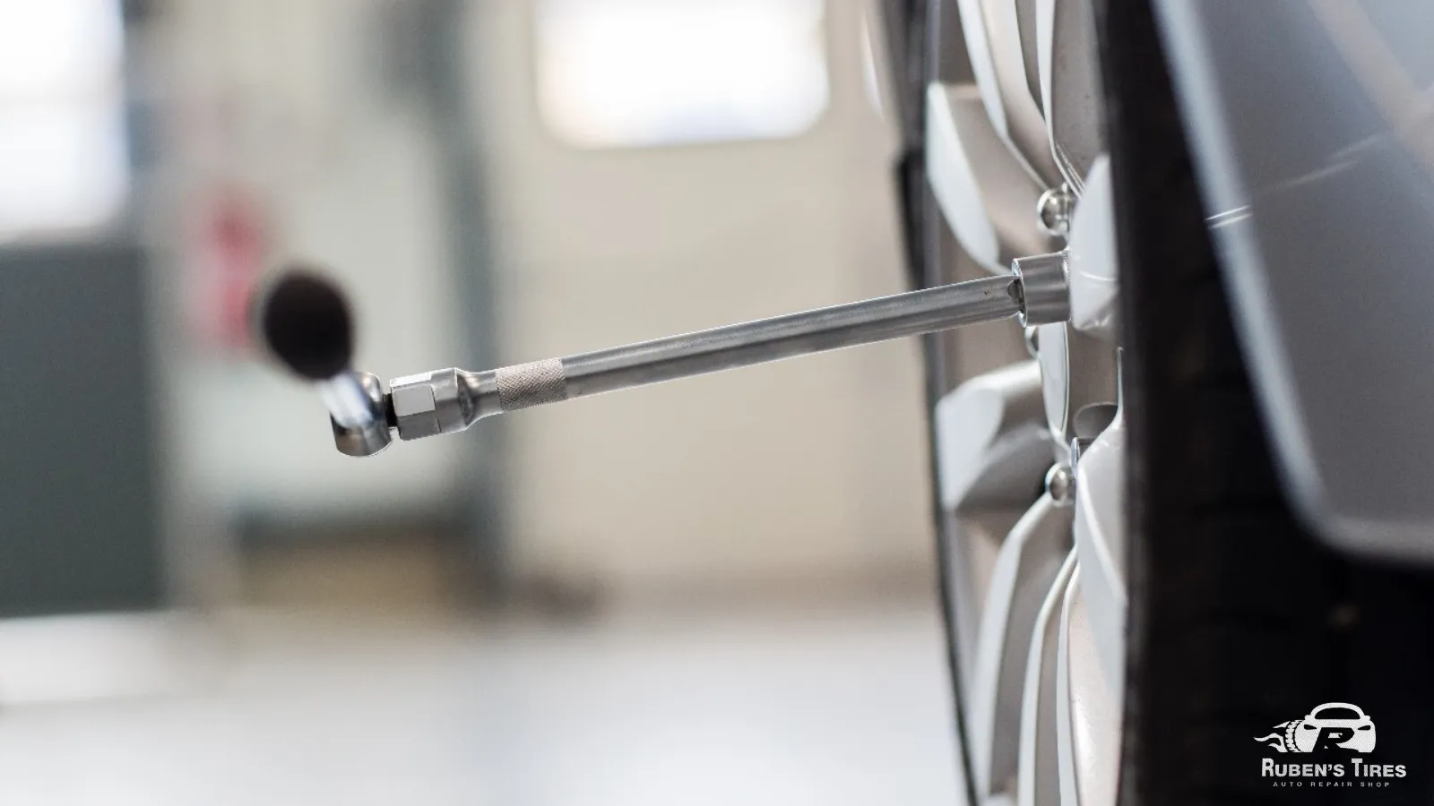 Precision balancing tools used for tire rotation services at Ruben’s Tires.