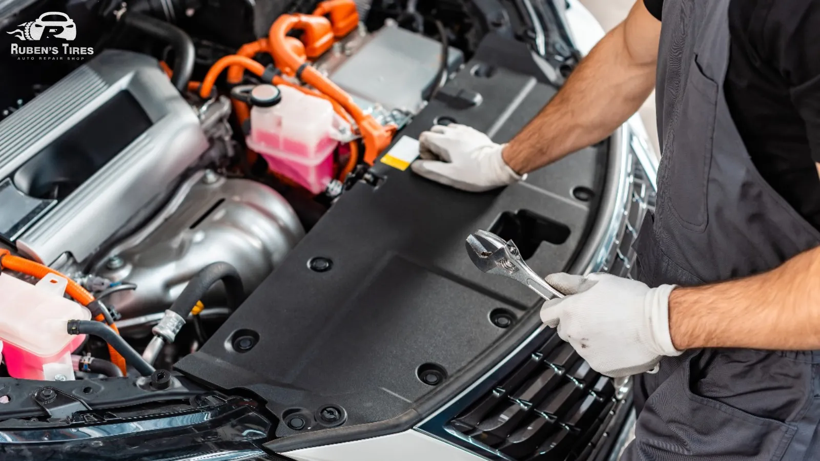 A technician repairing an engine with precision at Ruben’s Tires, a trusted auto repair shop in Altamonte.