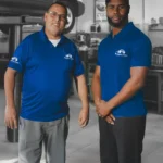 Ruben’s Tires team members standing confidently in the service bay, representing trusted and customer-focused Oil Change Altamonte Springs services.