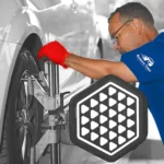 Technician performing precise wheel alignment on a vehicle, highlighting expert service and value offered through the Alignment Special Altamonte at Ruben’s Tires.